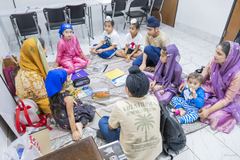 Children with their notebooks during a Punjabi class